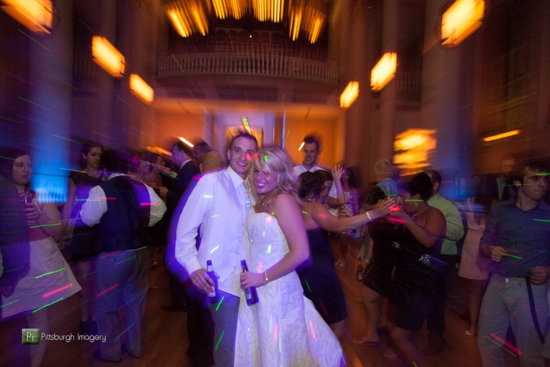 Newlywed bride and groom pose on the dance floor at a Grand Hall at the Priory, Pittsburgh wedding reception.