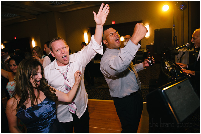 Guests dance and sing with the band at a Sheraton Station Square, Pittsburgh wedding.