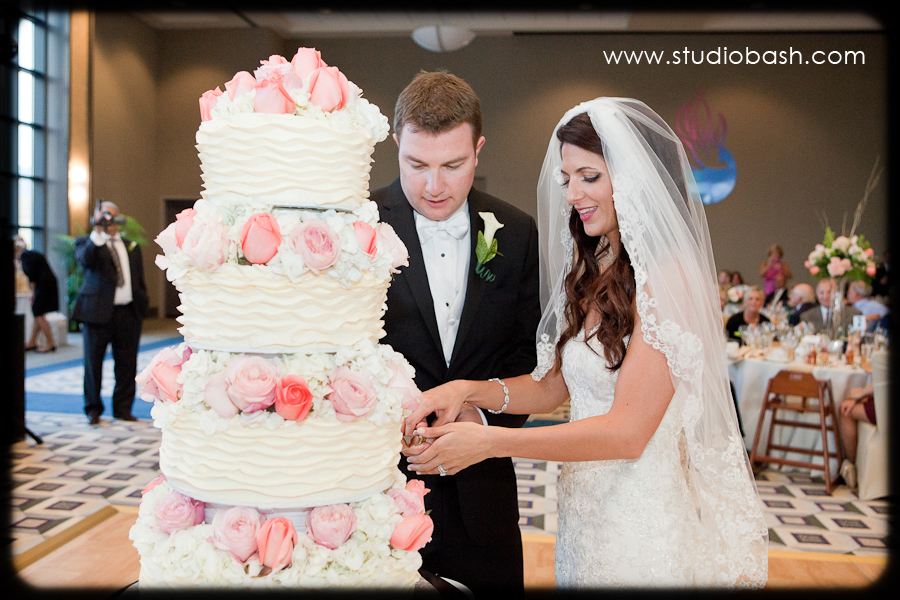 Power Center Ballroom Wedding Reception - Bride and Groom Take the First Slice of Wedding Cake