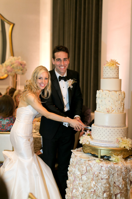 Hotel Monaco Pittsburgh Wedding Bride and Groom Cut Cake