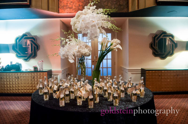 Wedding Orchids Lillies Centerpieces by Mocha Rose with Champagne Bottles with Tablecards